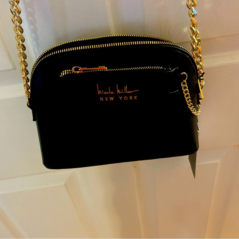 Black purse with gold chain straps